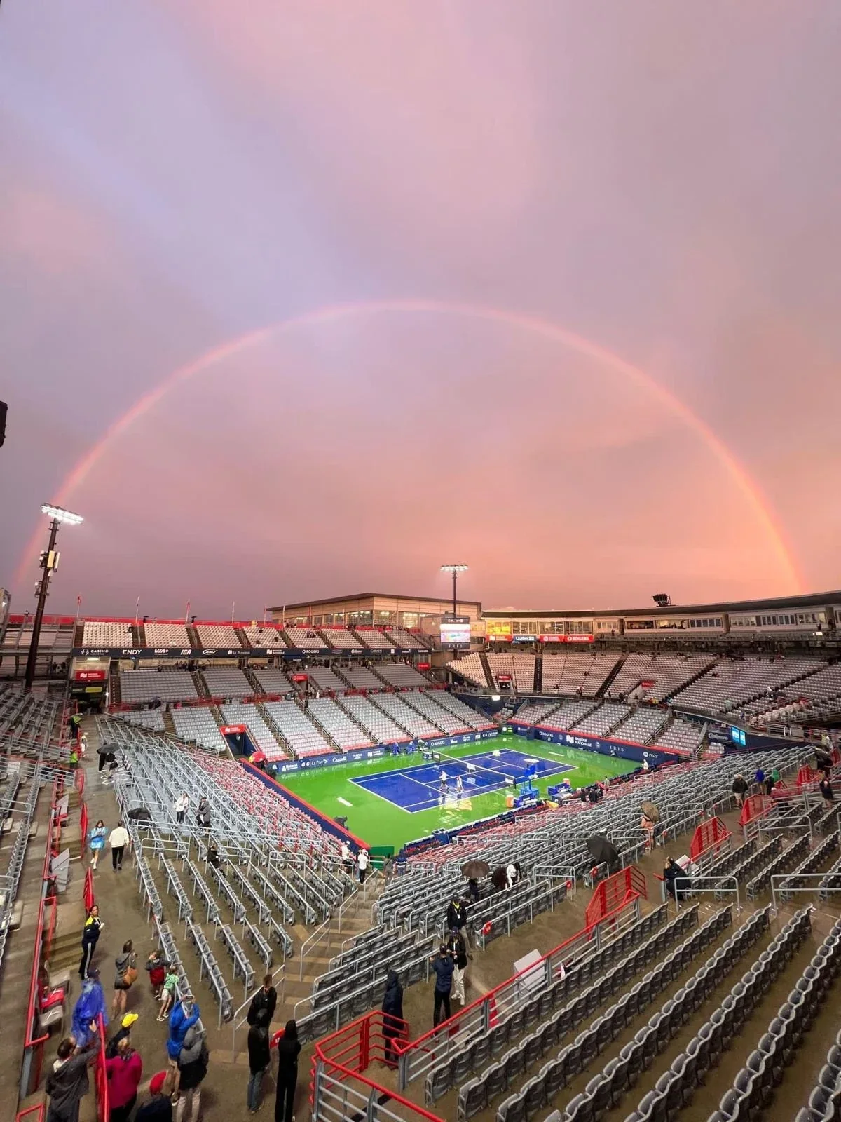 A rainbow arches over wet Centre Court after rain at the National Bank Open
